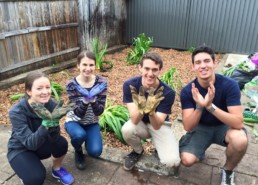 Four Vinnies Youth Members participating in Green Team and making a 'V' for Vinnies with their hands