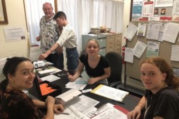 Vinnies Youth Members sitting around a table and organising an event