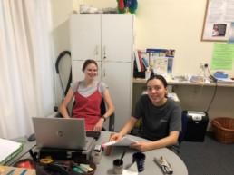 Two Vinnies Youth Members sitting at a computer and planning an event
