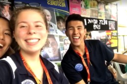 Three Vinnies Youth Members taking a selfie at a Vinnies Stall