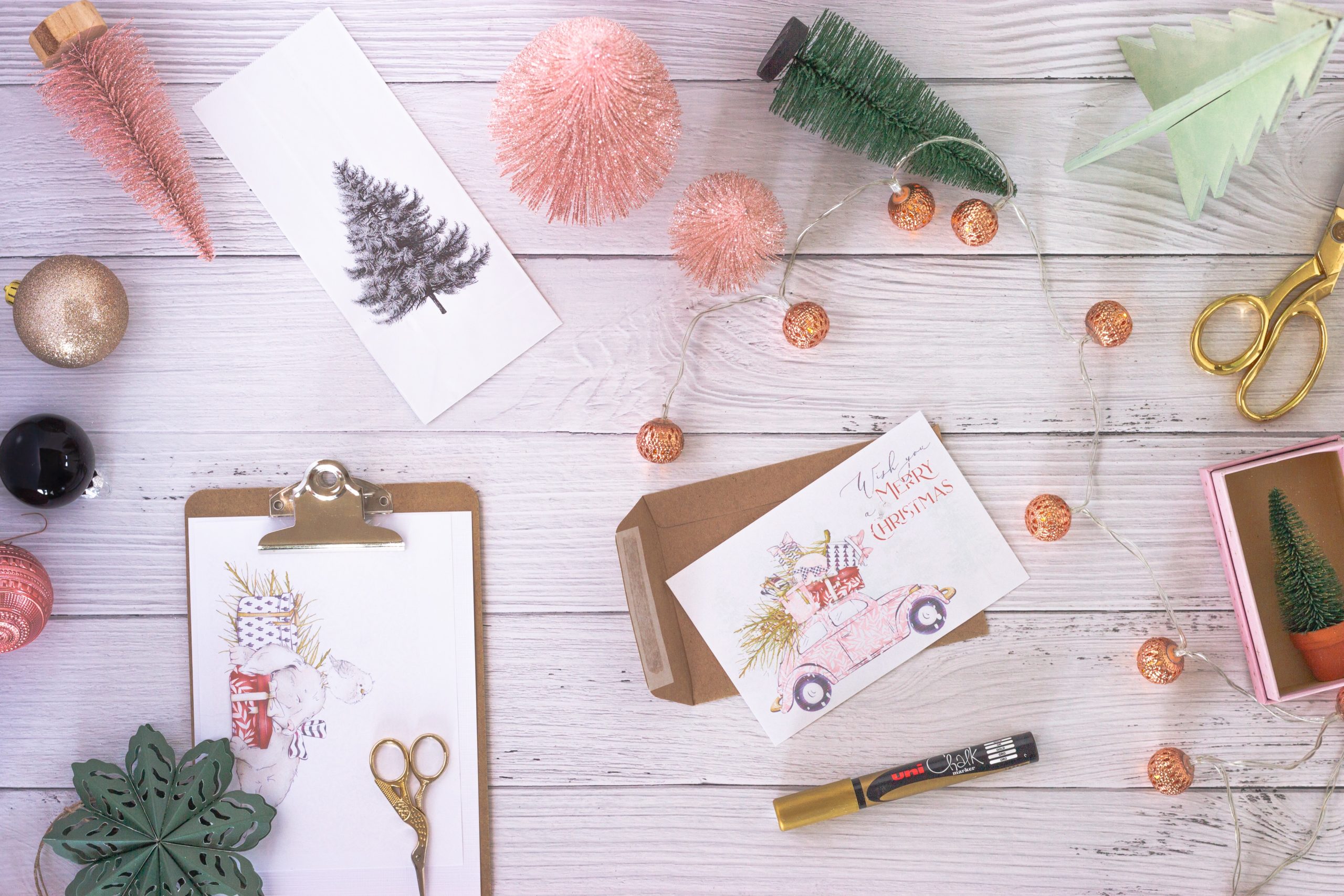 A table with Christmas decorations and Christmas cards
