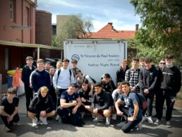 High school students standing behind the Vinnies Van Night Patrol truck